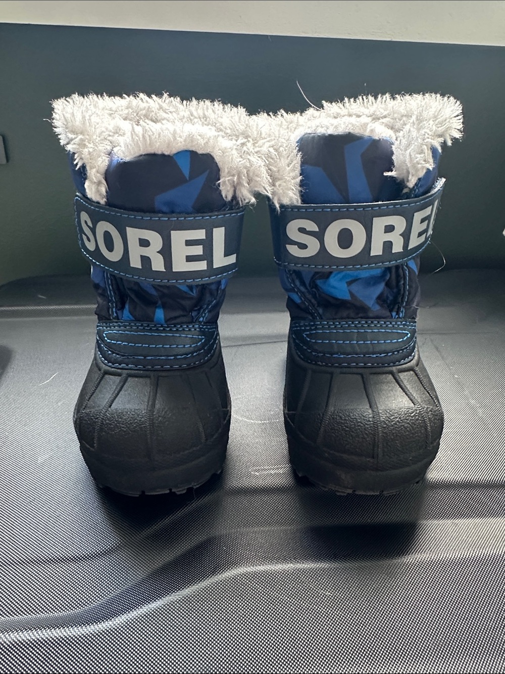 Sorel Blue and Black Kids Winter Boots with White Faux Fur